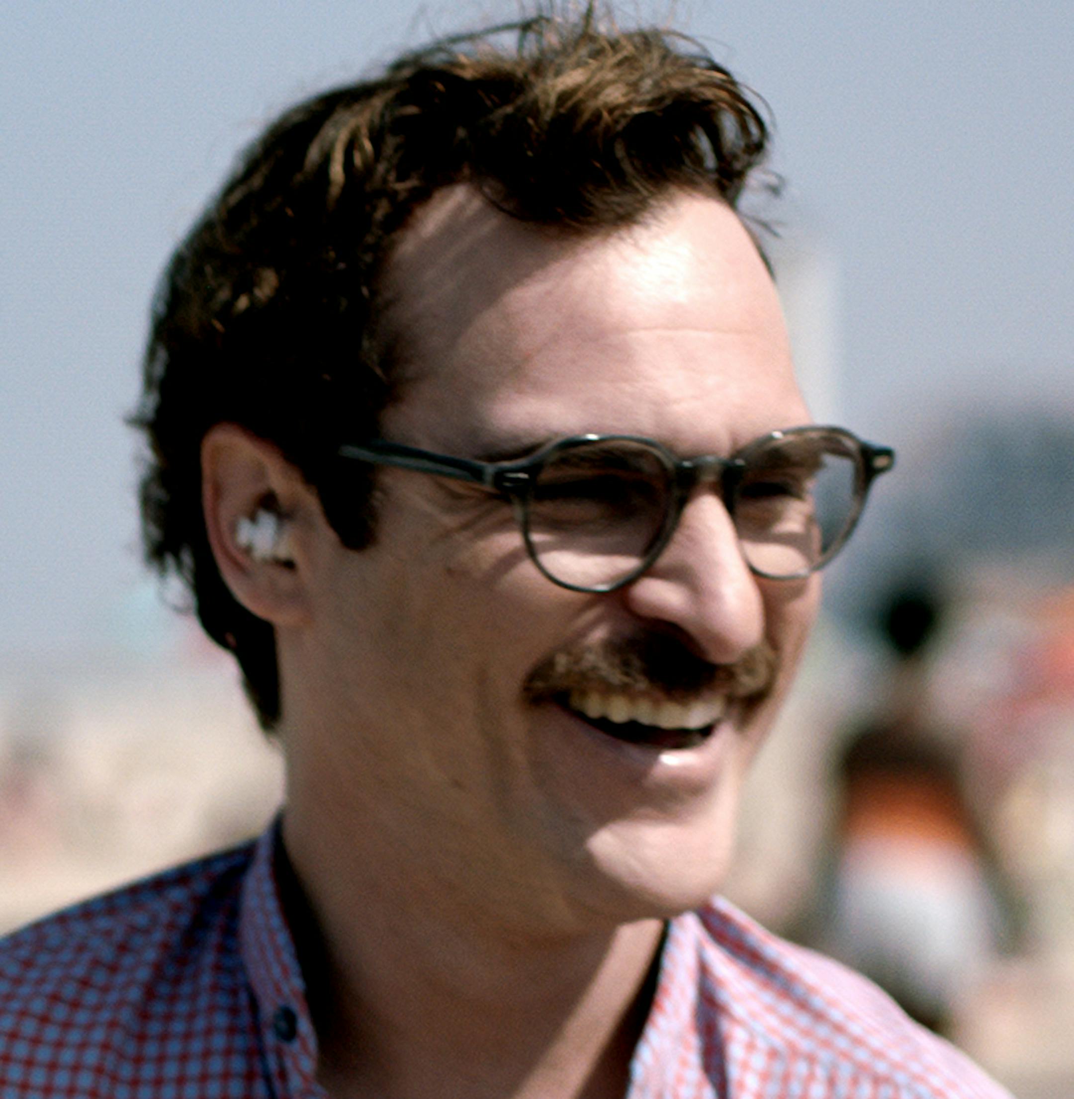 This image released by Warner Bros. Pictures shows Joaquin Phoenix in a scene from the film, "Her." Corruption tale &#xec;American Hustle,&#xee; digital love story &#xec;Her&#xee; and historic saga &#xec;12 Years a Slave&#xee; are among the motion picture nominees for the Producers Guild of America announced Thursday, Jan. 2, 2014. (AP Photo/Warner Bros. Pictures)