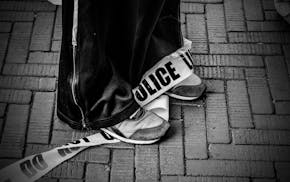 A protester and police line tape at Columbia University in New York, April 24, 2024.