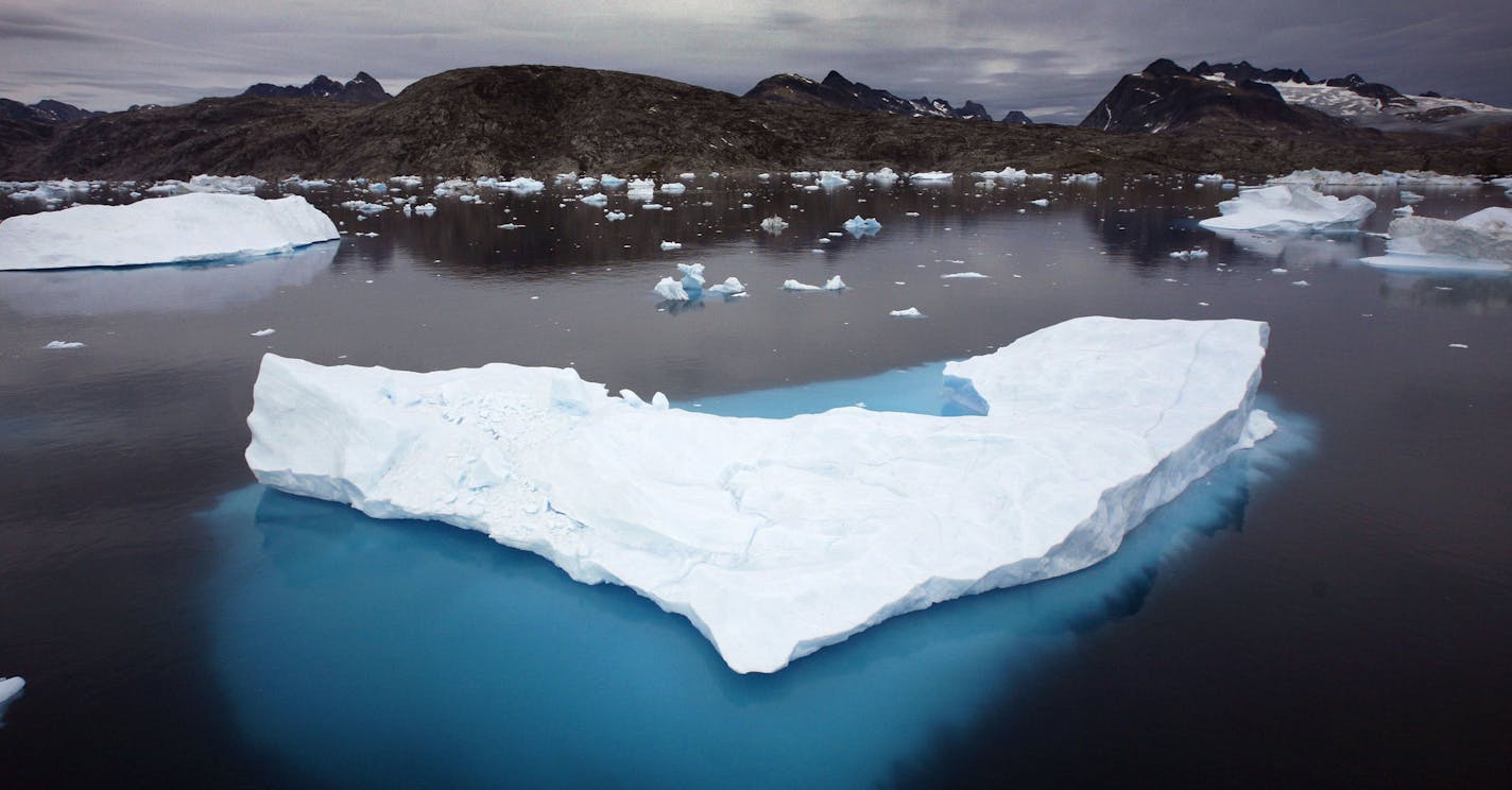 Icebergs float in a bay off Ammassalik Island, Greenland, July 19, 2007. U.N. Secretary-General Ban Ki-moon told an unprecedented summit on climate change Monday Sept. 24, 2007 that "the time for doubt has passed" and a breakthrough is needed in global talks to sharply reduce emissions of global-warming gases. Arctic sea ice melted to its lowest level ever this year, shattering a record set in 2005 and continuing a trend spurred by global warming. (AP Photo/John McConnico) ORG XMIT: JMC101