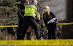St. Paul police investigators collected articles of clothing and a handbag as evidence at a scene they believed to be a murder suicide Saturday in the