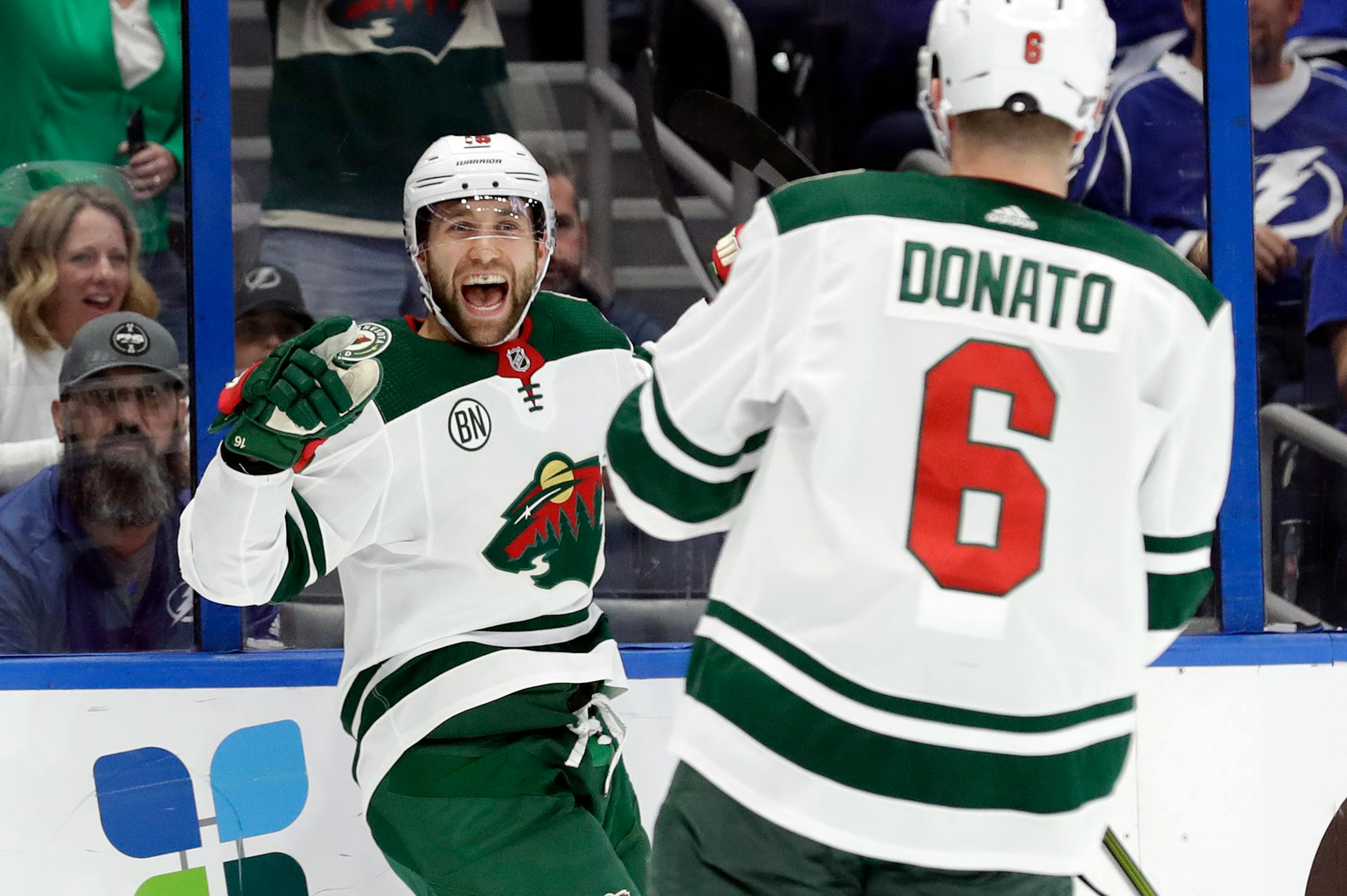 Minnesota Wild left wing Jason Zucker (16) celebrates his goal against the Tampa Bay Lightning with center Ryan Donato (16) during the first period of an NHL hockey game Thursday, March 7, 2019, in Tampa, Fla. (AP Photo/Chris O'Meara)