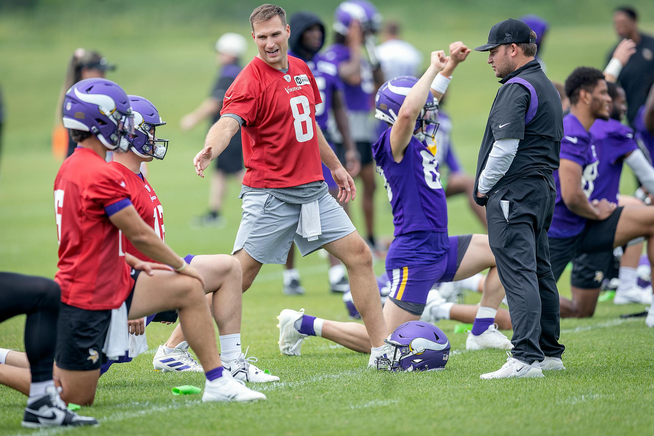 Vikings quarterback Kirk Cousins stretches before practice at the TCO Performance Center in Eagan, Minn., on Tuesday, June 6, 2023.