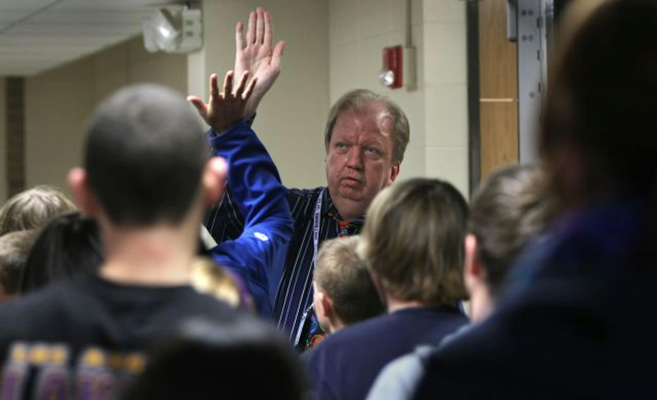 Towering over most students at 6 foot, 7 inches, St. Anthony Village, Neil Brackett high-fived students in the hallway as they changed classes.