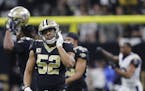 New Orleans Saints linebacker Craig Robertson (52) leaves the field after overtime of the NFL football NFC championship game against the Los Angeles R