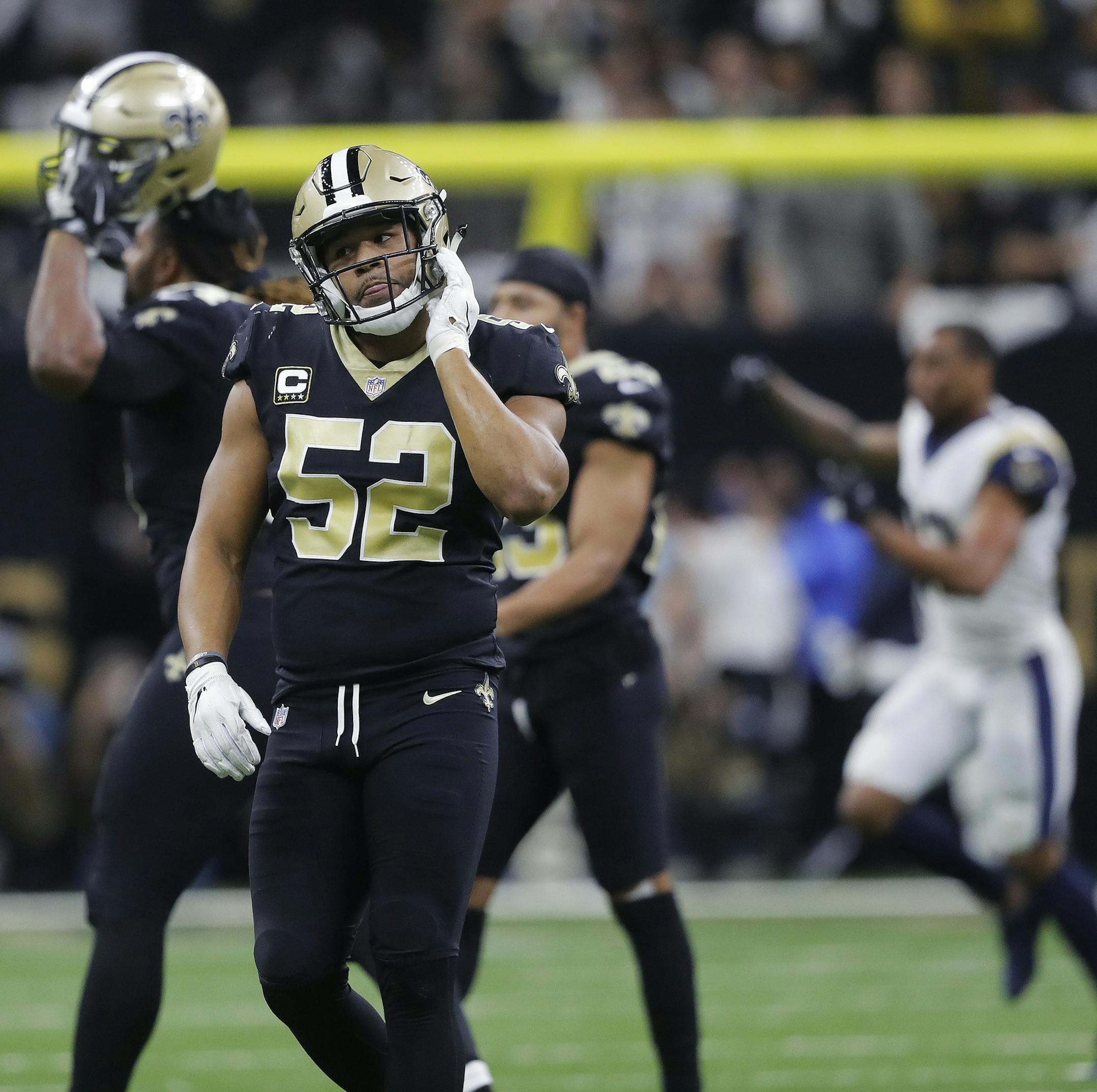 New Orleans Saints linebacker Craig Robertson (52) leaves the field after overtime of the NFL football NFC championship game against the Los Angeles Rams, Sunday, Jan. 20, 2019, in New Orleans. The Rams won 26-23. (AP Photo/Gerald Herbert)