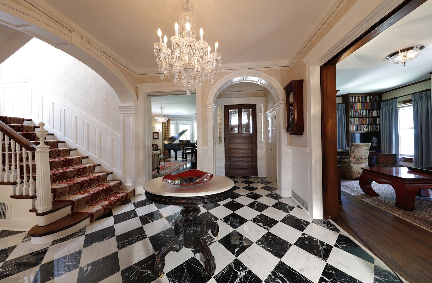 The entry in Dave and Karen Hartje's home is enhanced with arches and elaborate millwork, part of the Summit Hill House Tour.