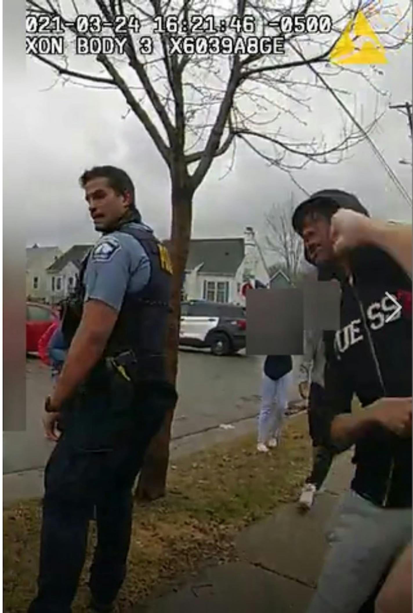 A screenshot from body camera footage shows Minneapolis police officer William Gregory punching Damareion McKizzie in the face before he is taken into custody.