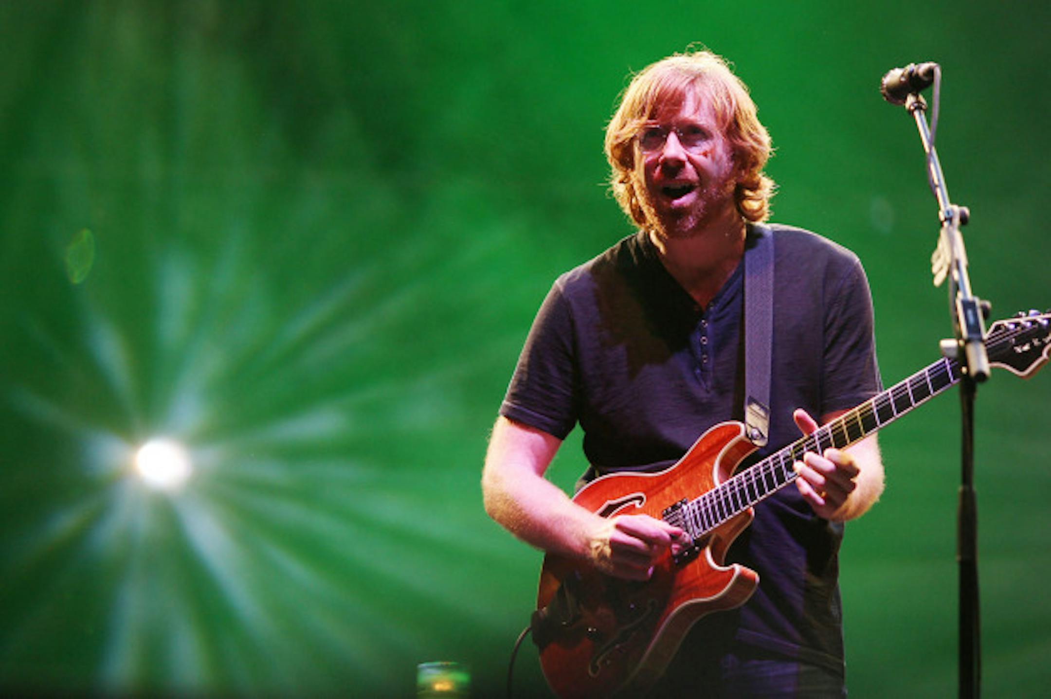 Trey Anastasio played to a green backdrop when Phish headlined Bonnaroo in 2009, and there should be a lot more green stuff around him at Xcel Center on June 22. / Amanda Schwab, AP/Starpix