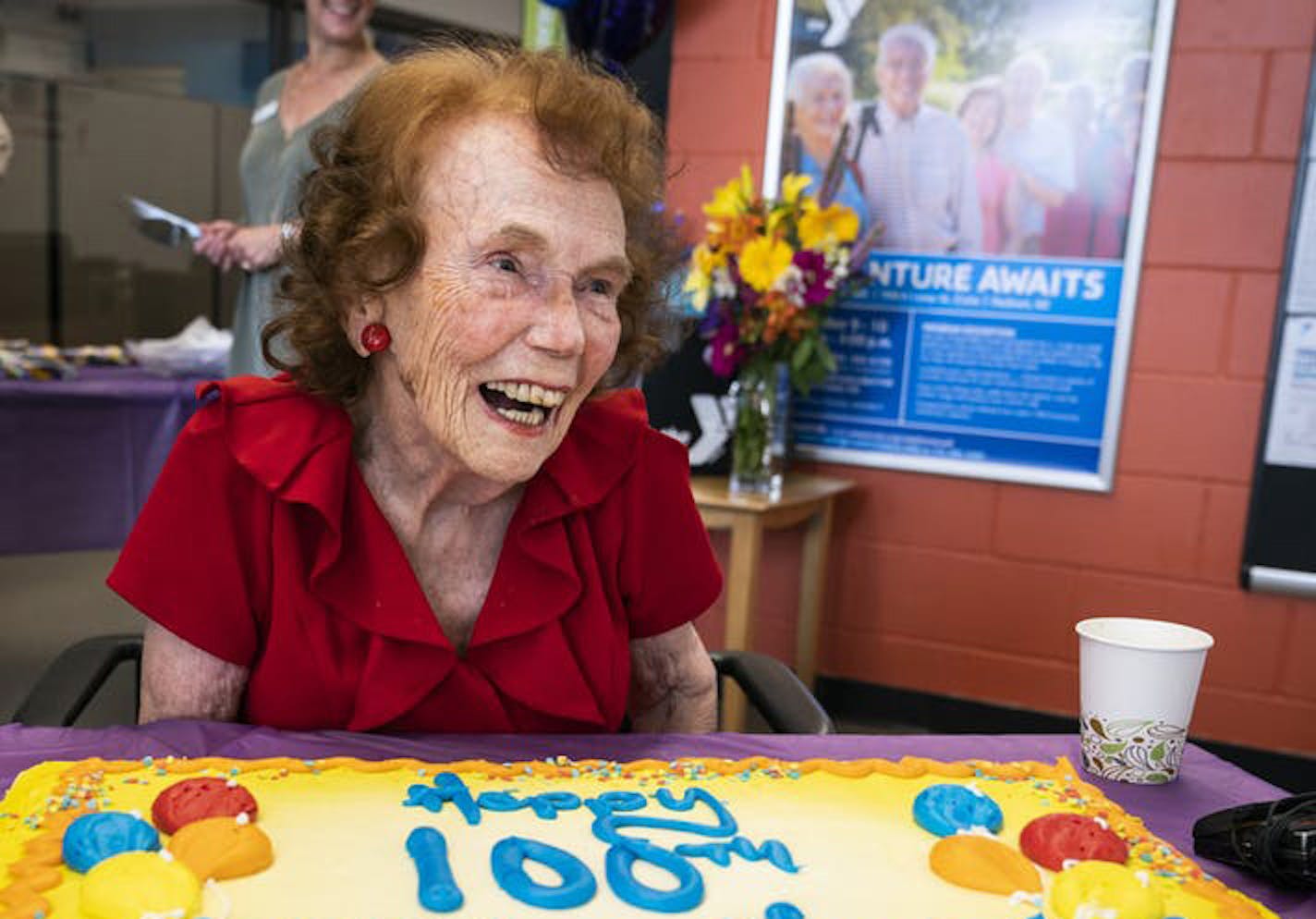 Marjorie Johnson sits in front of her birthday cake. Johnson, who allows herself 150 calories of sweets per day, enjoyed a tiny slice with coffee.