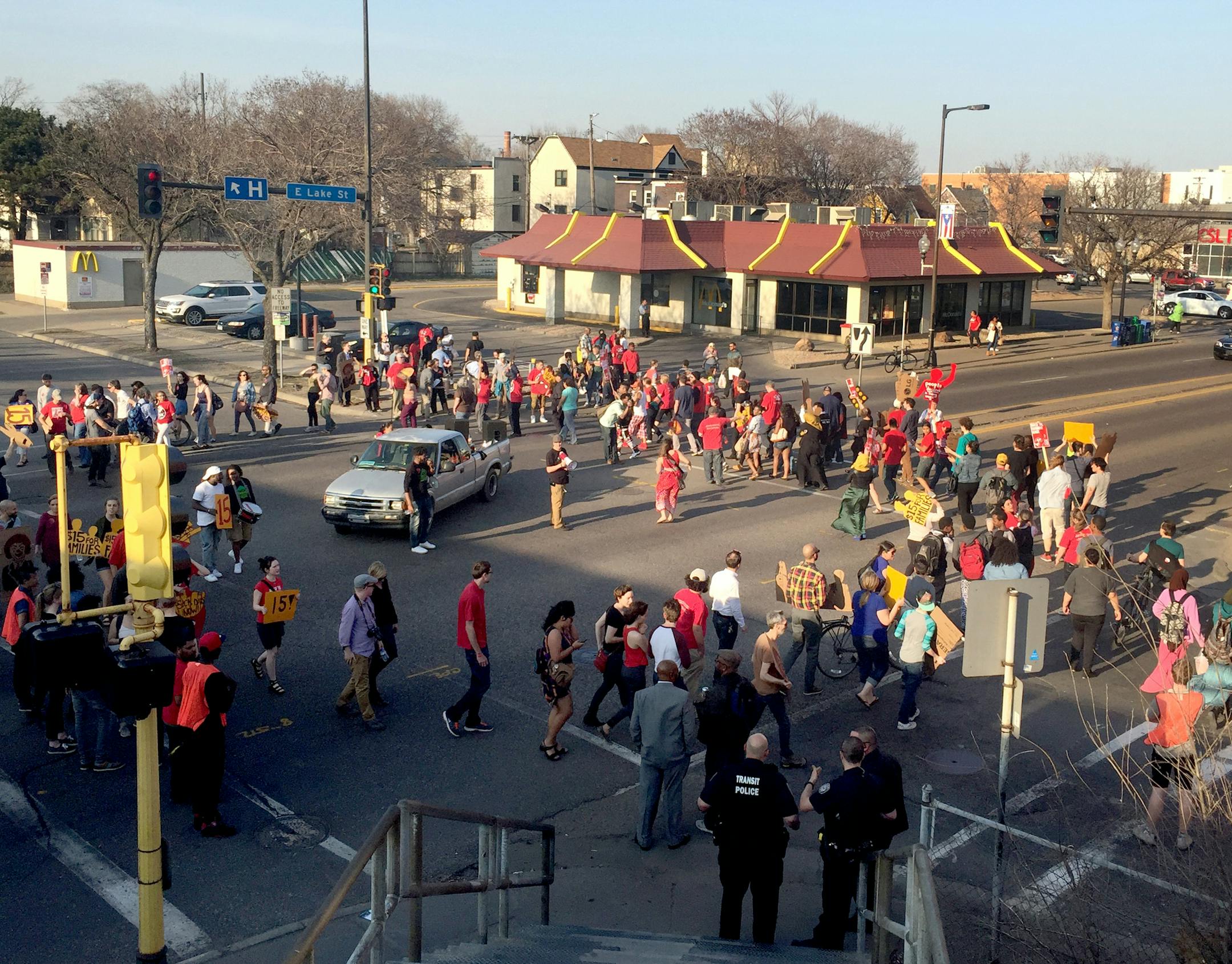 Members and supporters of Neighborhoods Organizing for Change blocked off a portion of East Lake Street during a fast-food workers's strike on April 14. The group has asked Gov. Mark Dayton to address racial disparities in the state.