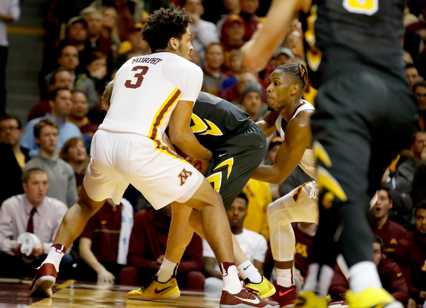 Jordan Murphy (3) fought for the ball with Brady Ellingson late in the second half against Iowa last month.