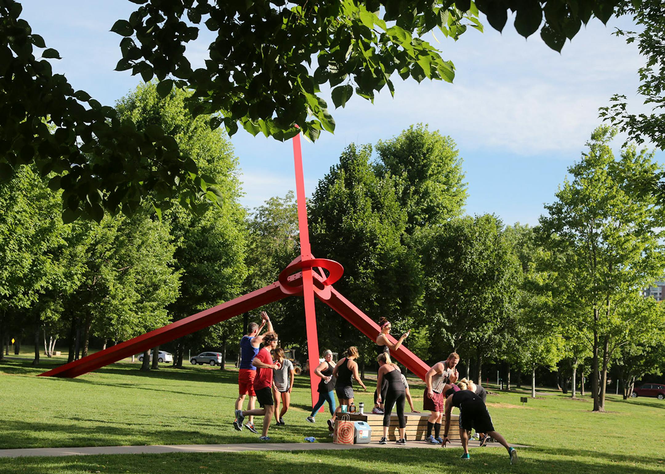 The Downtown Minneapolis Neighborhood Association has worked in conjunction with the Gold Medal Park Foundation in order to offer up free yoga classes for the growing population of Minneapolis. Here, participants in a fitness boot camp work out Saturday, June 17, 2017, in Gold Medal Park in Minneapolis, MN.