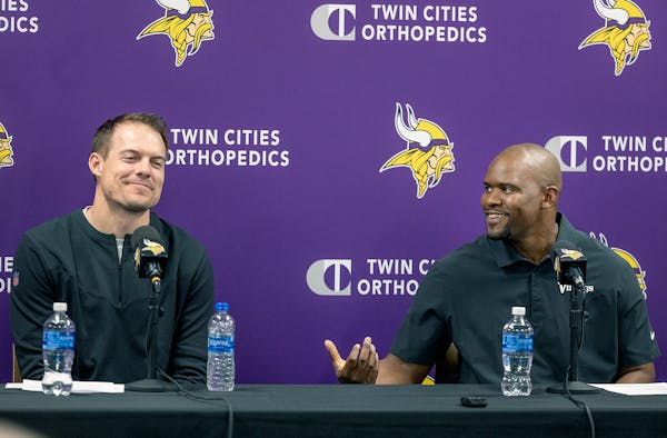 Minnesota Vikings head coach Kevin O'Connell, left, introduces new defensive coordinator Brian Flores during an NFL football news conference, Wednesda