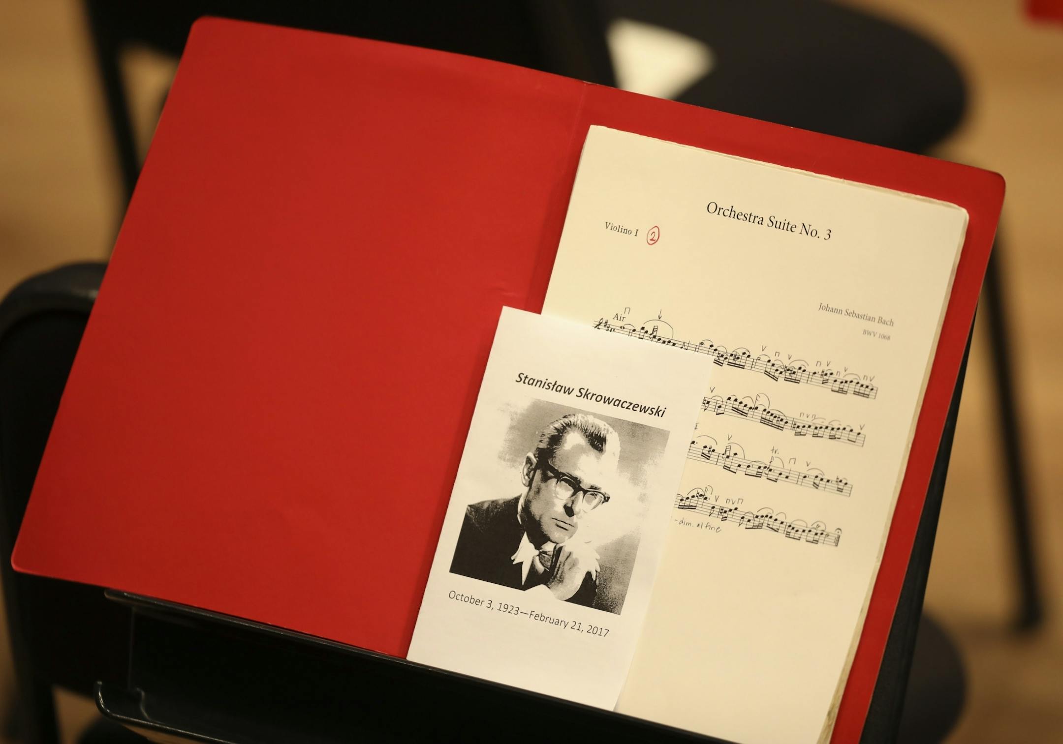 Before the musicians of the Minnesota Orchestra were on stage, a memorial service program rested on a Minnesota Orchestra violinist's stand along with the music for the service.