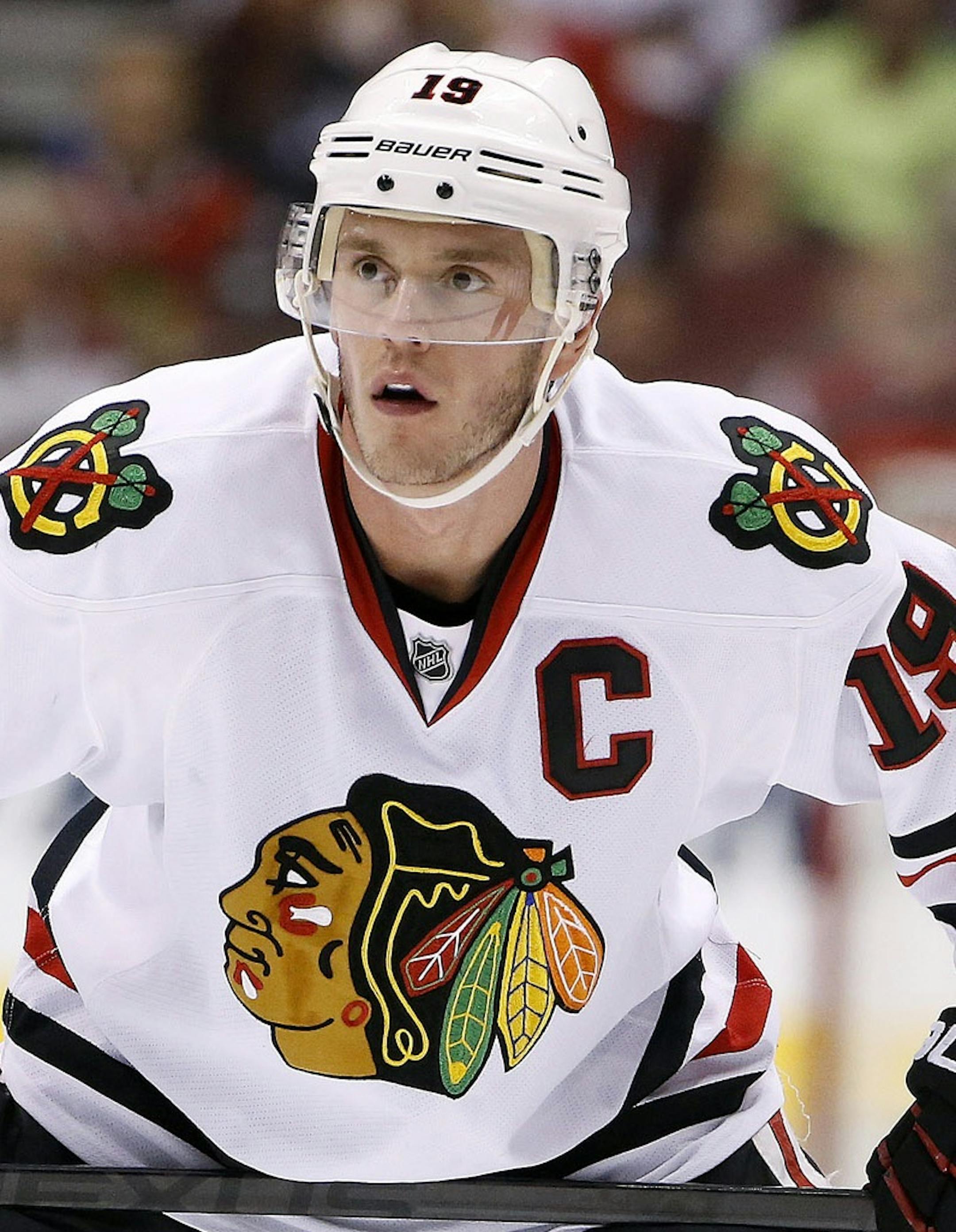 Chicago Blackhawks' Jonathan Toews waits for a face-off against the Arizona Coyotes during the first period of an NHL hockey game Thursday, March 12, 2015, in Glendale, Ariz. The Blackhawks defeated the Coyotes 2-1. (AP Photo/Ross D. Franklin)