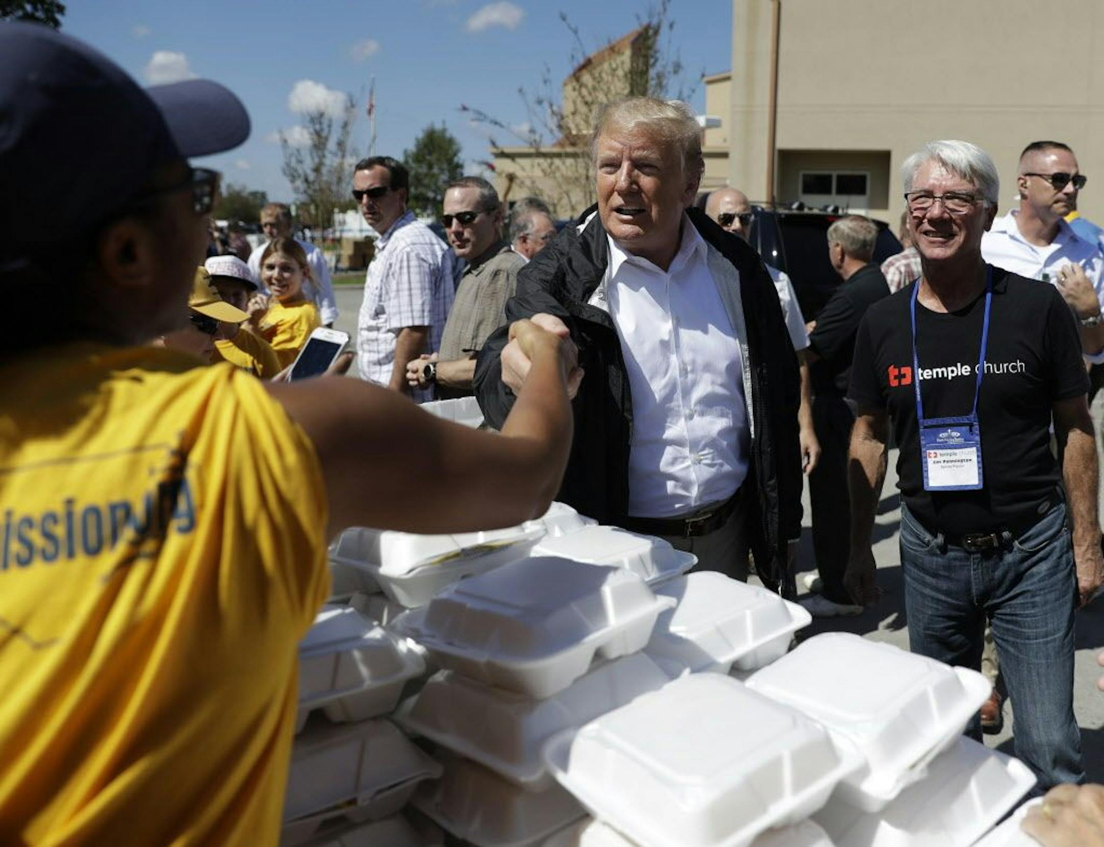 President Donald Trump visits the Temple Baptist Church, where food and other supplies are being distributed during Hurricane Florence recovery efforts, Wednesday, Sept. 19, 2018, in New Bern, N.C. (AP Photo/Evan Vucci)