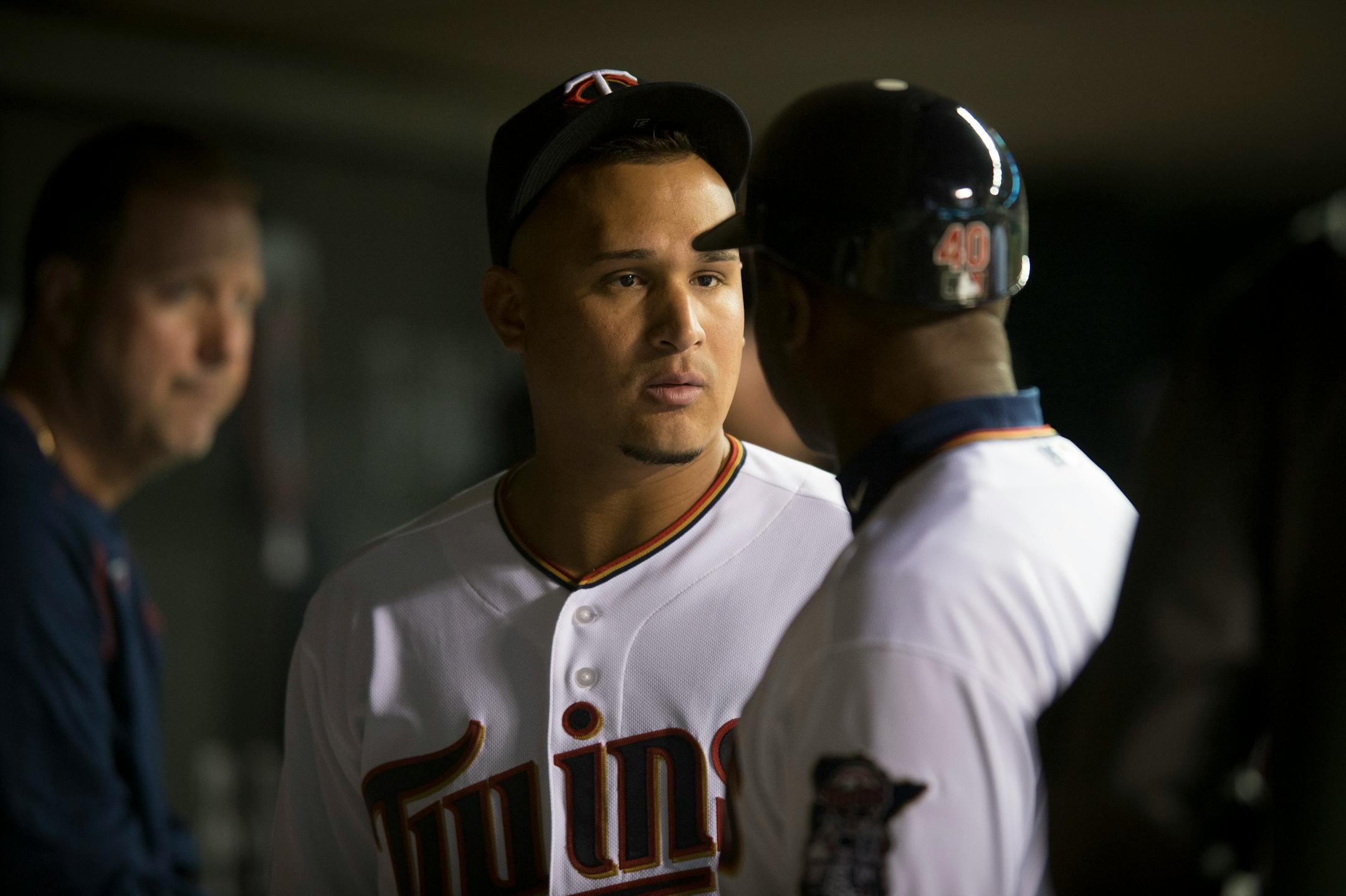 Minnesota Twins left fielder Oswaldo Arcia chats with first base coach Butch Davis in the dugout between innings during Wednesday night's game against the Kansas City Royals. ] (Aaron Lavinsky | StarTribune) aaron.lavinsky@startribune.com The Minnesota Twins play the Kansas City Royals on Wednesday, April 15, 2015 at Target Field.