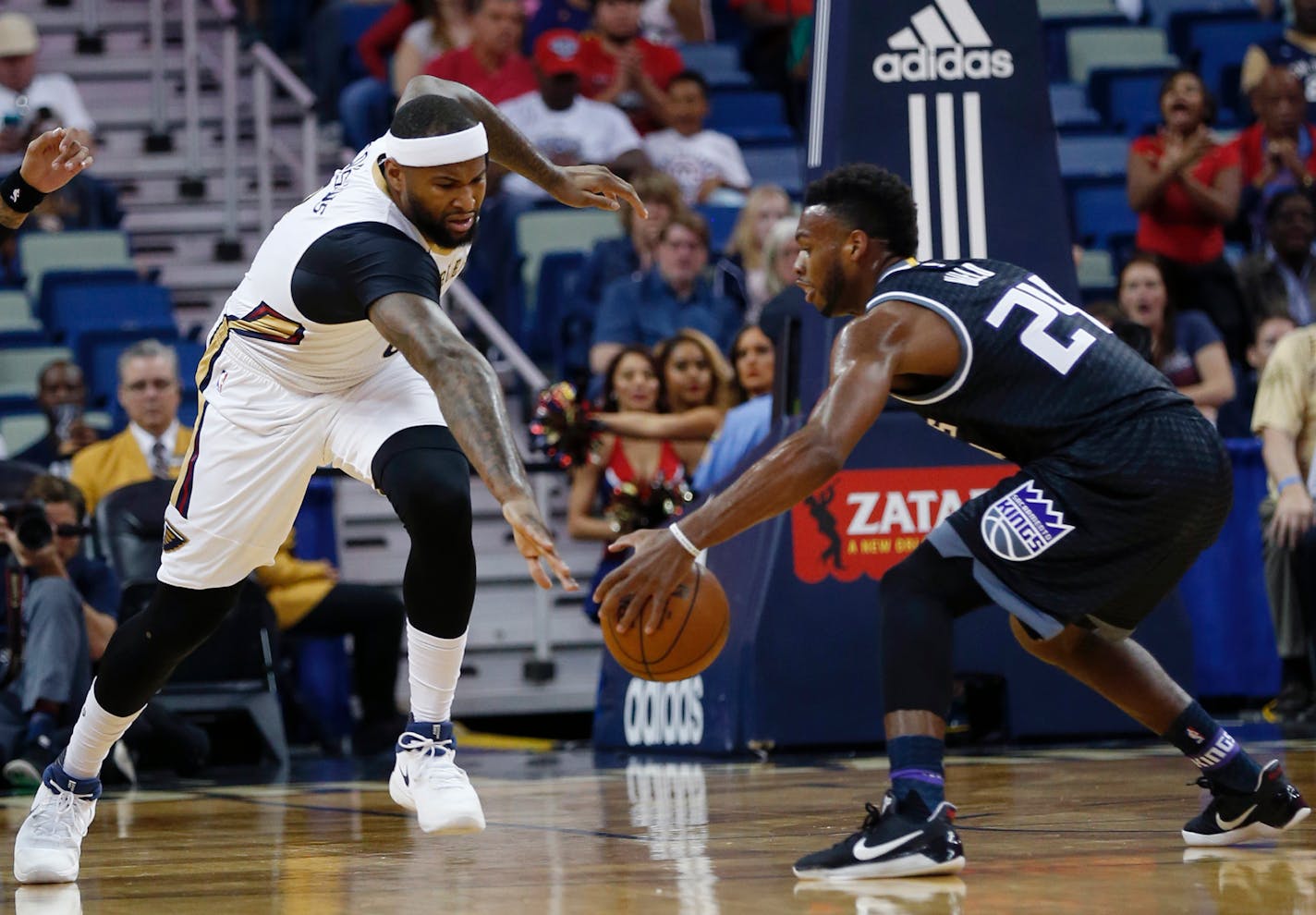 New Orleans Pelicans forward DeMarcus Cousins, left