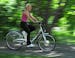 Karen Howells, 52, of Long Lake, says "most people don't even realize that it's an electric bike until I come right up on them." The bike can go 20 mi