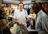 State Rep. Jim Abeler asked Somalis for their vote in the August 12 primary in his race against Mike McFadden to go up against Sen. Al Franken for the U.S. Senate seat. He handed out brochures in both English and Somali Friday after prayers at Somali Village Market in Minneapolis. ] Friday, August 1, 2014. GLEN STUBBE * gstubbe@startribune.com ORG XMIT: MIN1408011641271205
