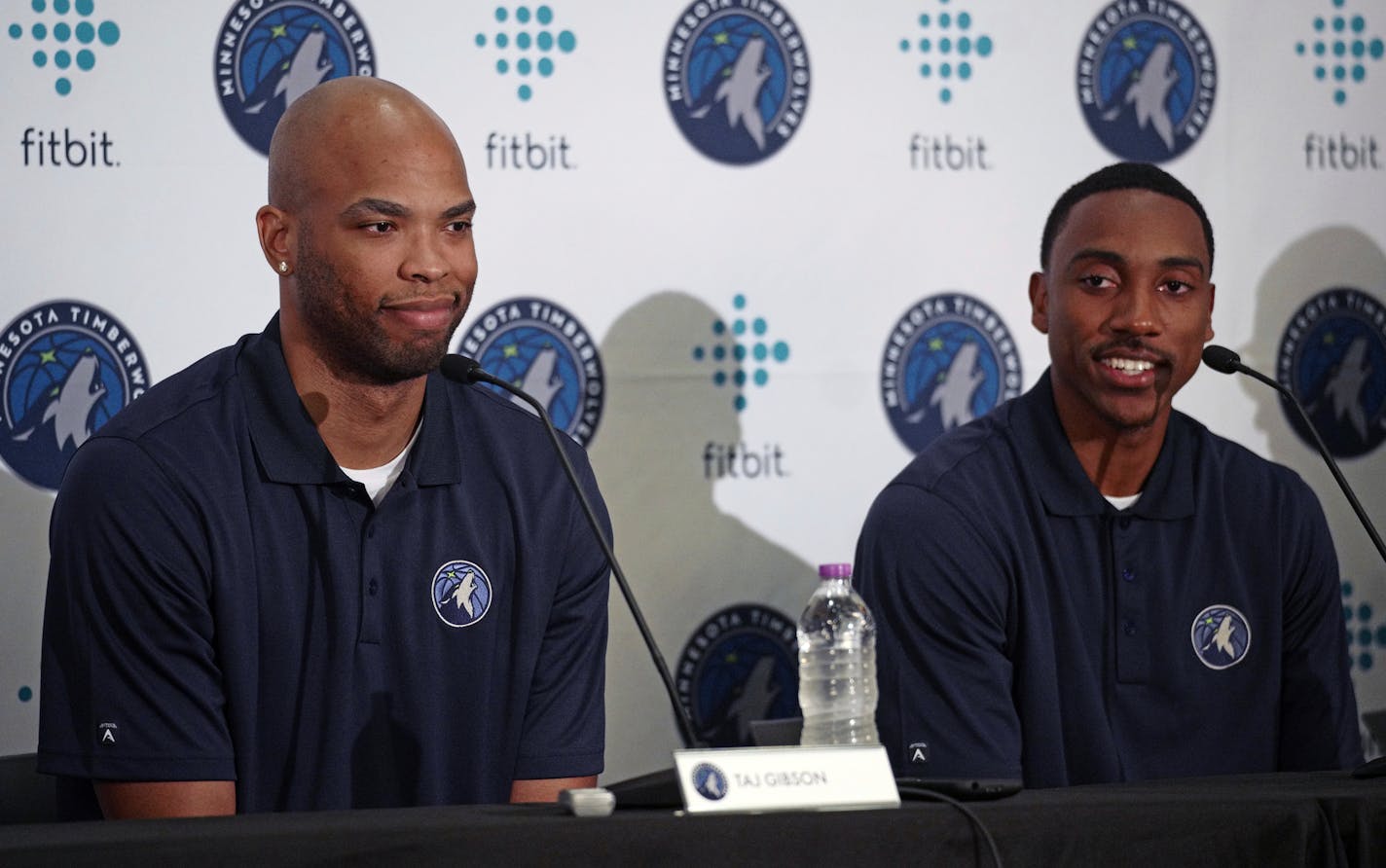 New Minnesota Timberwolves team members Taj Gibson, left, and Jeff Teague, right, sit together in Minneapolis, Monday, July 10, 2017. (Richard Tsong-Taatarii/Star Tribune via AP)