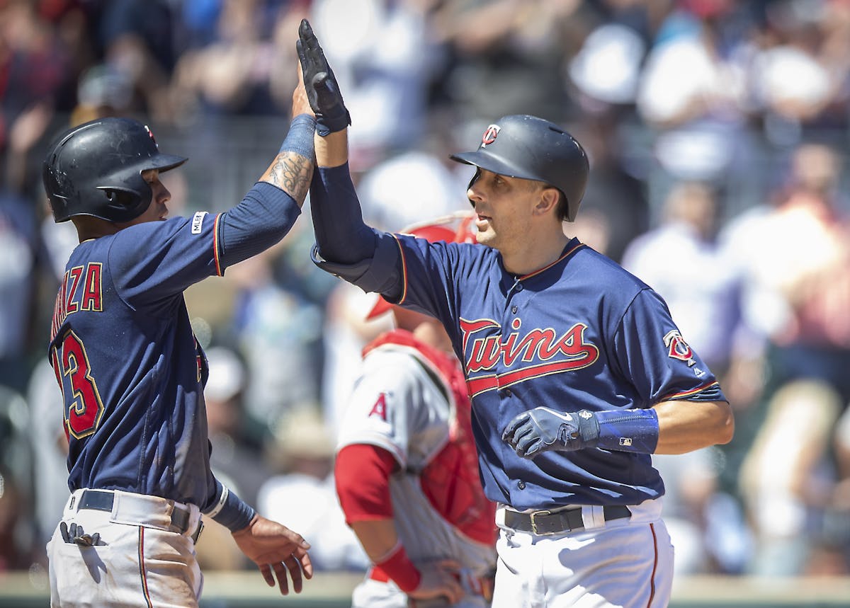 Twins catcher Jason Castro celebrated a two-run homer with Twins shortstop Ehire Adrianza during the sixth inning.