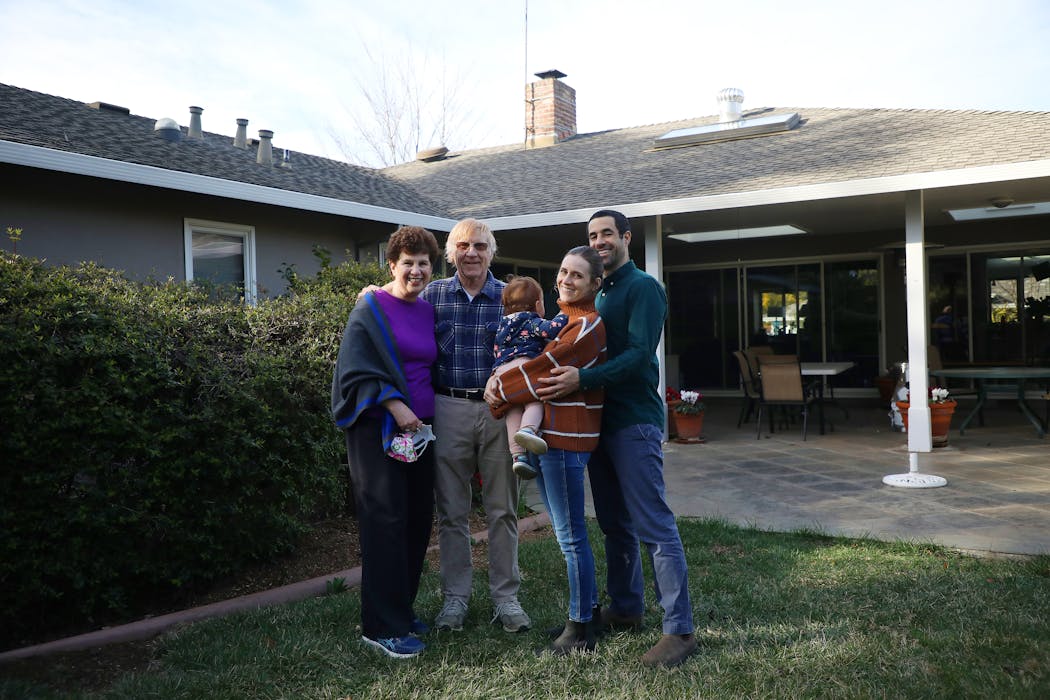 Shira Anderson, her husband, Yochai Ben-Haim, and their daughter, Alma, in Los Altos, Calif.
