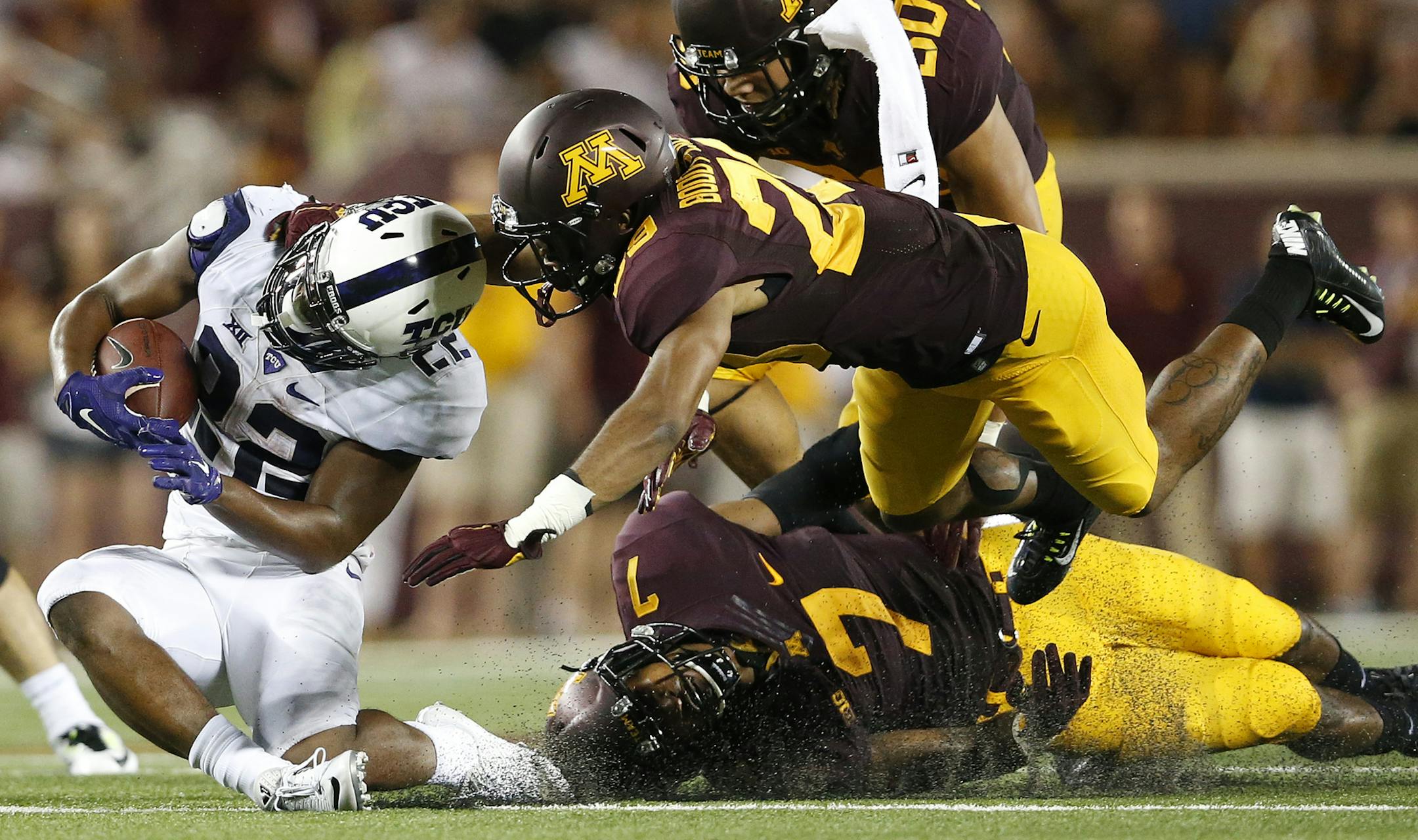 Aaron Green (22) of TCU was tackled by Briean Boddy Calhoun (29) and Damarius Travis (7) in the third quarter. ] CARLOS GONZALEZ cgonzalez@startribune.com - September 3, 2015, Minneapolis, MN, TCF Bank Stadium, NCAA Football, Big 10, University of Minnesota Golden Gophers vs. Texas Christian University TCU Horned Frogs