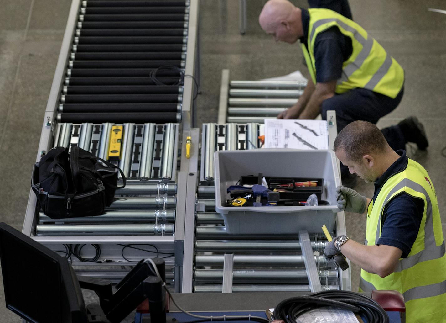 Workers installed new automatic screening lanes in the south checkpoint at the Minneapolis-St. Paul International Airport. The four lanes will be available for first class and pre check travelers. ] CARLOS GONZALEZ &#xef; cgonzalez@startribune.com - August 22, 2017, Bloomington, MN, MSP Airport Terminal 1, Passengers flying out of Minneapolis-St. Paul International Airport may need extra time to pass through security as all the general lanes at the south security checkpoint in Terminal 1 will be