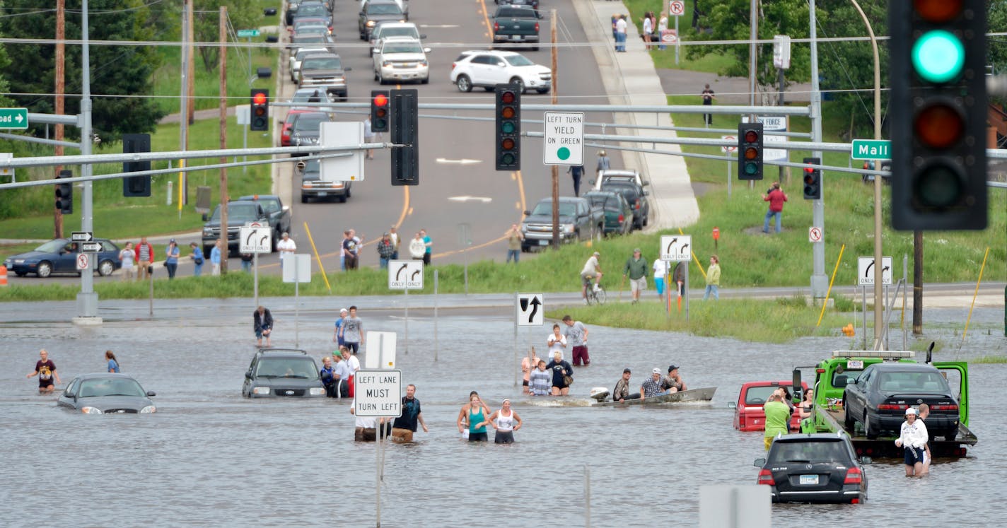 With over 9 inches of rain overnight and into Wednesday morning in Duluth Washouts, sinkholes and mudslides have taxed area roads. Many government buildings and businesses are closed. Here, flood waters cover the roads near Hwy 53 and Miller Hill Mall. ] BRIAN PETERSON â€¢ brianp@startribune.com Duluth, MN - 06/20/2012