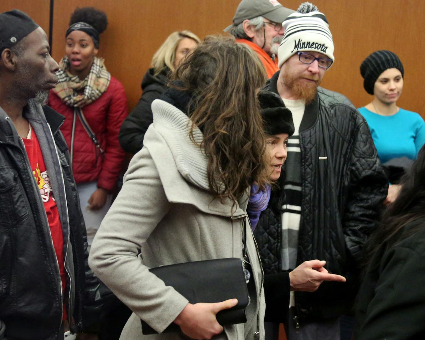 Supporters of Marcus Fischer, the 18-year-old man who was shot by police during a tense standoff in an interview room, stand in line in the the Government Center to pass through security on their way to talk to district Hennepin County DA Mike Freeman about the case Tuesday, Dec. 26, 2017, in Minneapolis, MN. Eric Fischer, father of Marcus Fischer, is in the Minnesota knit hat. ] DAVID JOLES &#x2022; david.joles@startribune.com DAVID JOLES &#xef; david.joles@startribune.com Marcus Fischer, the 1