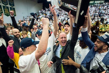 Vermont coach John Becker celebrates their 66-49 win over Maryland-Baltimore County in the championship of the America East Tournament. Last year, UMB