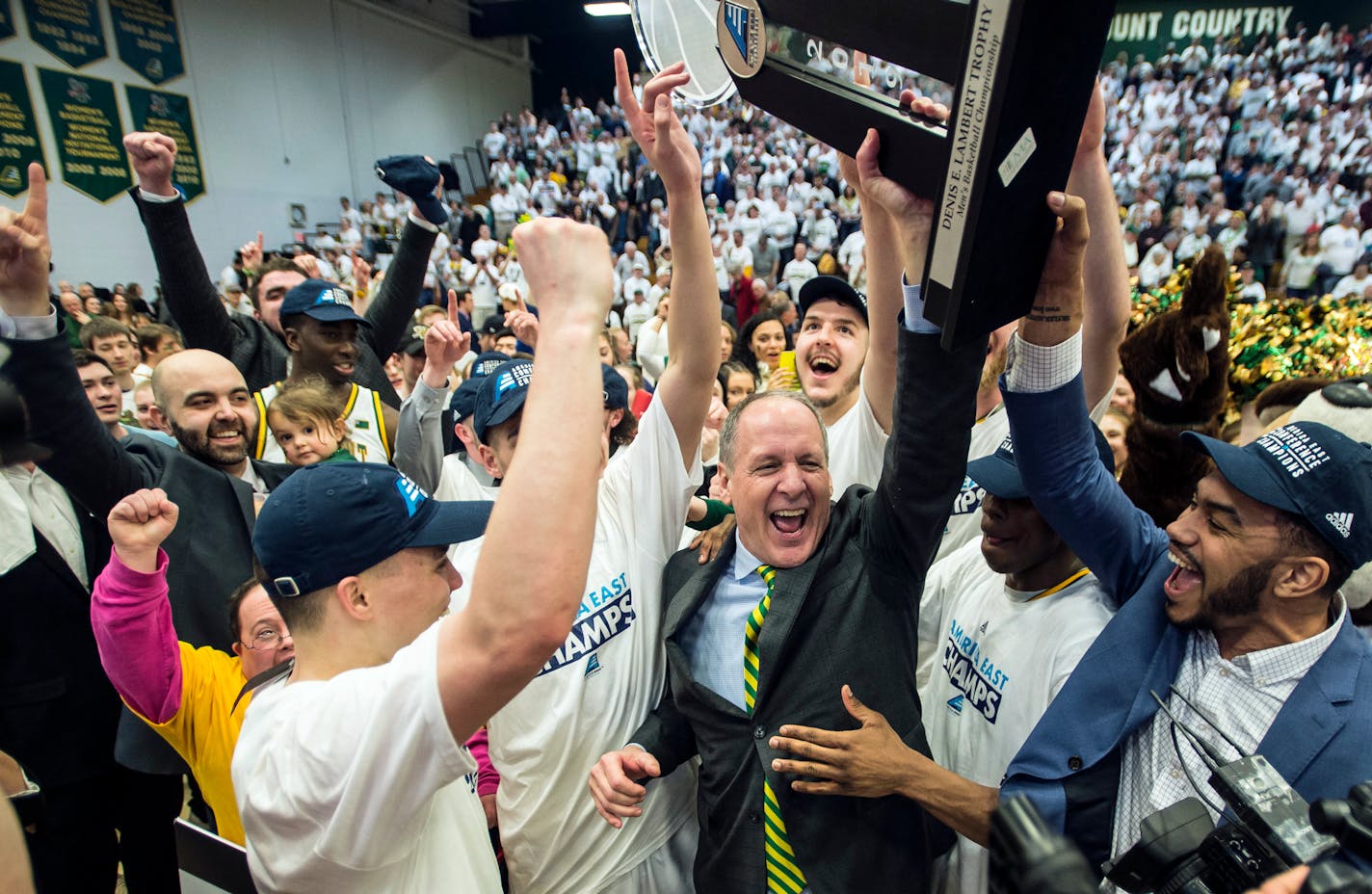 Vermont coach John Becker celebrates their 66-49 win over Maryland-Baltimore County in the championship of the America East Tournament. Last year, UMBC defeated Virginia as a 16 seed.