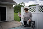 Deb Jerikovsky on the patio of her new home with her grandchildren in Coon Rapids.