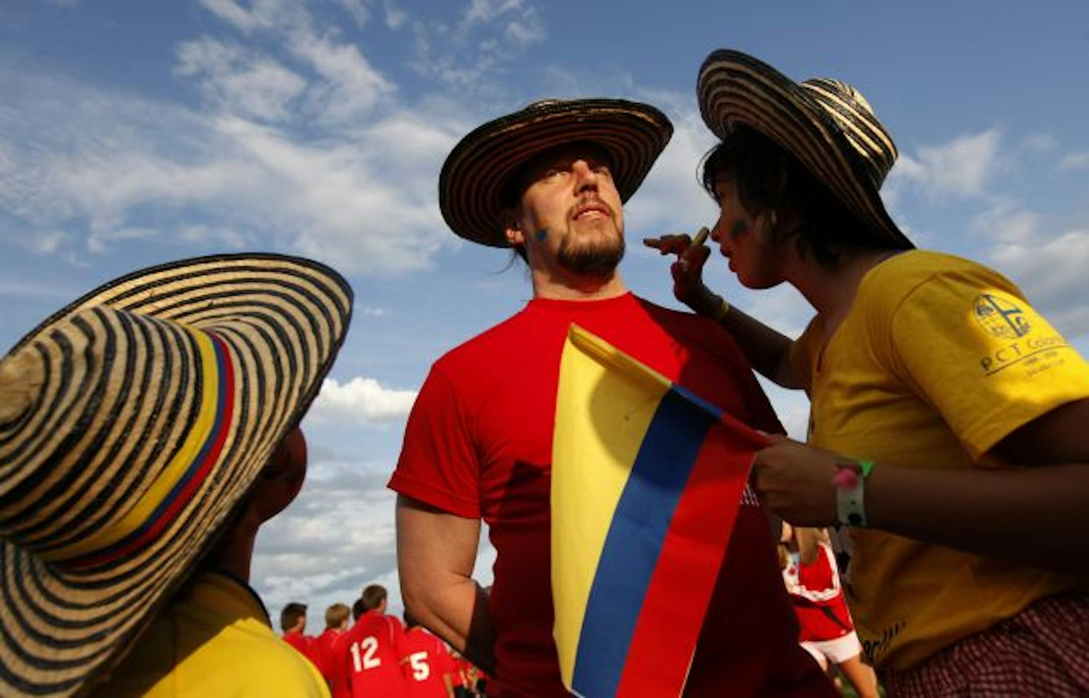 New Ulm native Daniel Skillings, getting his face painted, has been bringing youth soccer teams to Blaine from Colombia for 21 years.