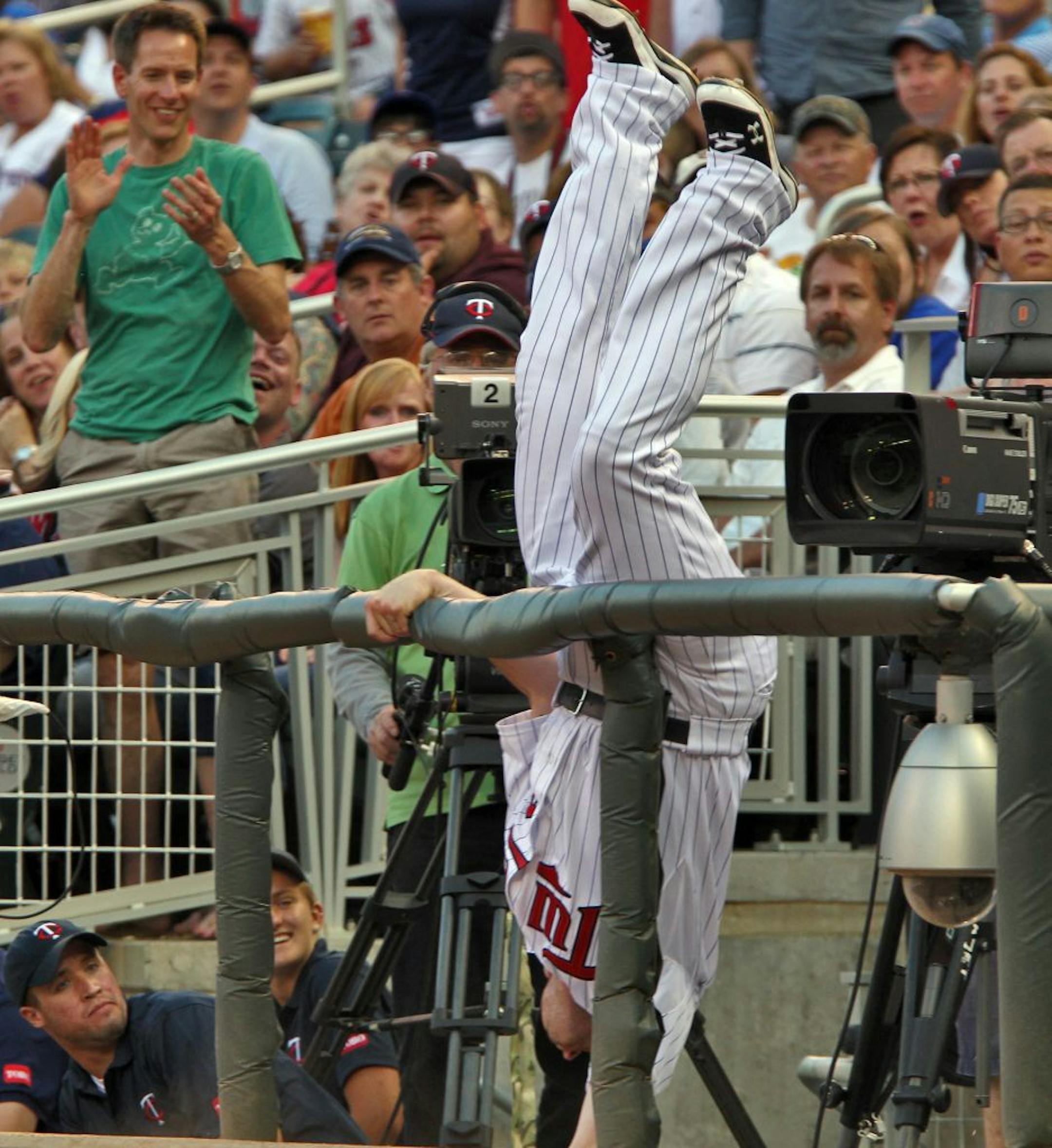 Minnesota Twins vs. Chicago Cubs. Twins first baseman Chris Parmelee gave it his all as he flipped into the first base camera well chasing a foul pop fly hit by Cubs Joe Mather in the 4th inning. Parmalee did not catch the ball. (MARLIN LEVISON/STARTRIBUNE(mlevison@startribune.com