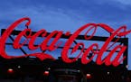 FILE - In this July 20, 2019, photo a Coca-Cola billboard is shown over left field at SunTrust Park during a baseball game between the Washington Nati