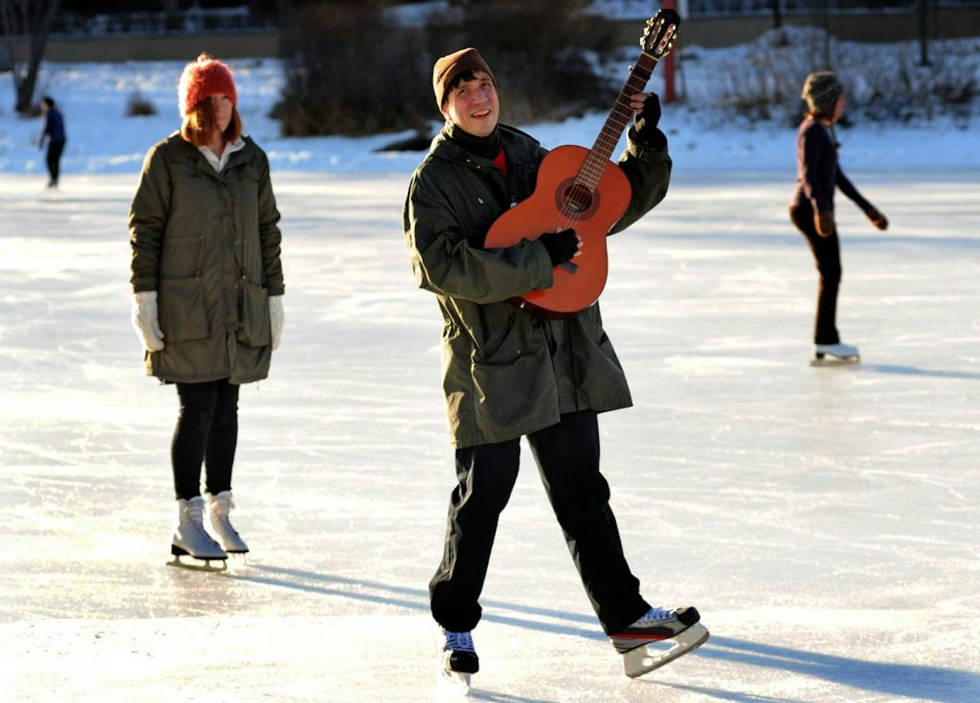 Singer/songwriter Jim Ruiz with his drummer and wife Emily on Lake of the Isles, harking back to a vintage Joao Gilberto album cover that originally gave Ruiz his "Legendary" name.