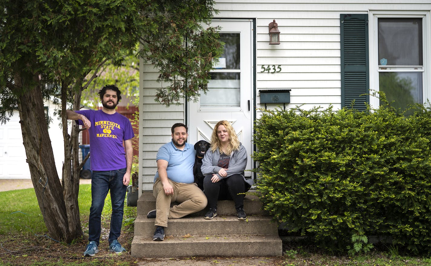 Meghan McManus, from right, and her husband Aaron Albee pose for a photo with their roommate Tony Cola and dog Dexter outside their Fridley home. ] LEILA NAVIDI &#x2022; leila.navidi@startribune.com BACKGROUND INFORMATION: Meghan McManus and her husband Aaron Albee pose for a photo with their roommate Tony Cola in their Fridley home on Wednesday, May 22, 2019. Getting married used to mean being done with roommates and building a nest with a beloved. But today, more couples - and not only young o