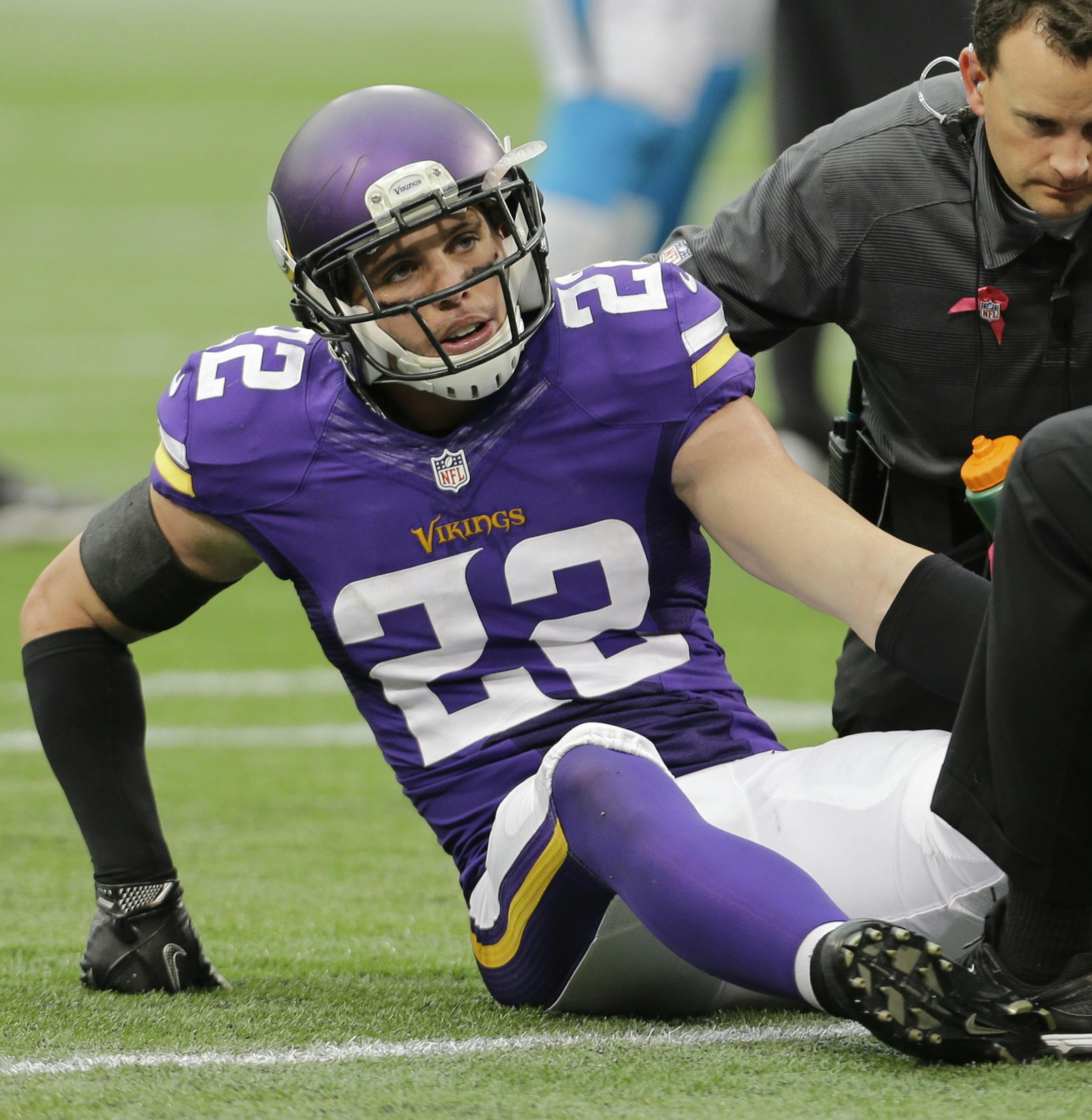 Minnesota Vikings free safety Harrison Smith is checked by medical personnel after being injured during the second half of an NFL football game against the Carolina Panthers in Minneapolis, Sunday, Oct. 13, 2013. (AP Photo/Ann Heisenfelt) ORG XMIT: NYOTK