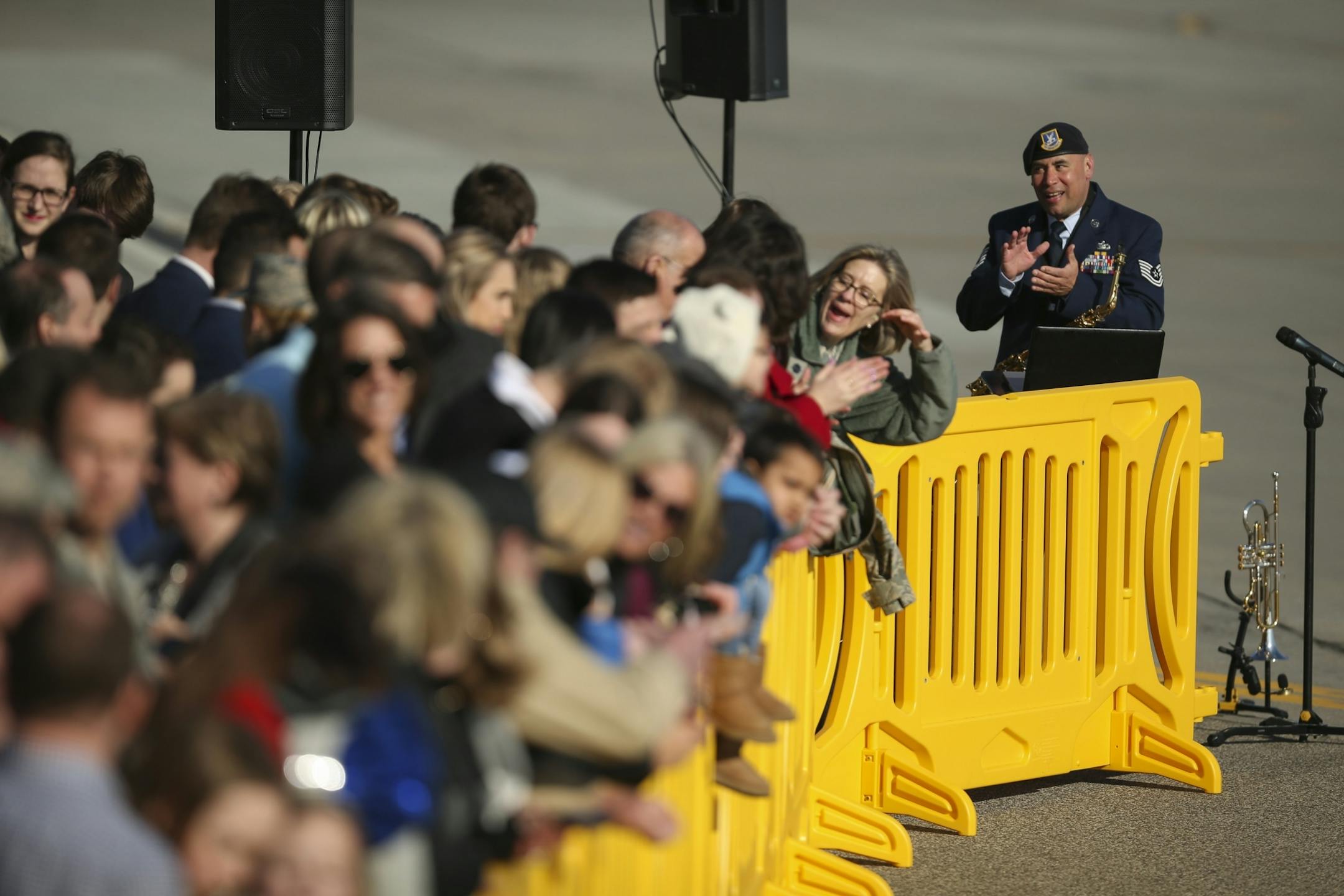 Air Force Reservist Tech Sgt. Johnny Holliday tried to engage the crowd of guests waiting for the arrival of Vice President Mike Pence while he performed for them on saxophones and trumpet at the Minnesota National Guard - 934th Airlift Wing earlyTuesday evening.