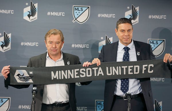 Minnesota United coach Adrian Heath, left and Sporting Director Manny Lagos have the first pick in Friday's MLS SuperDraft.