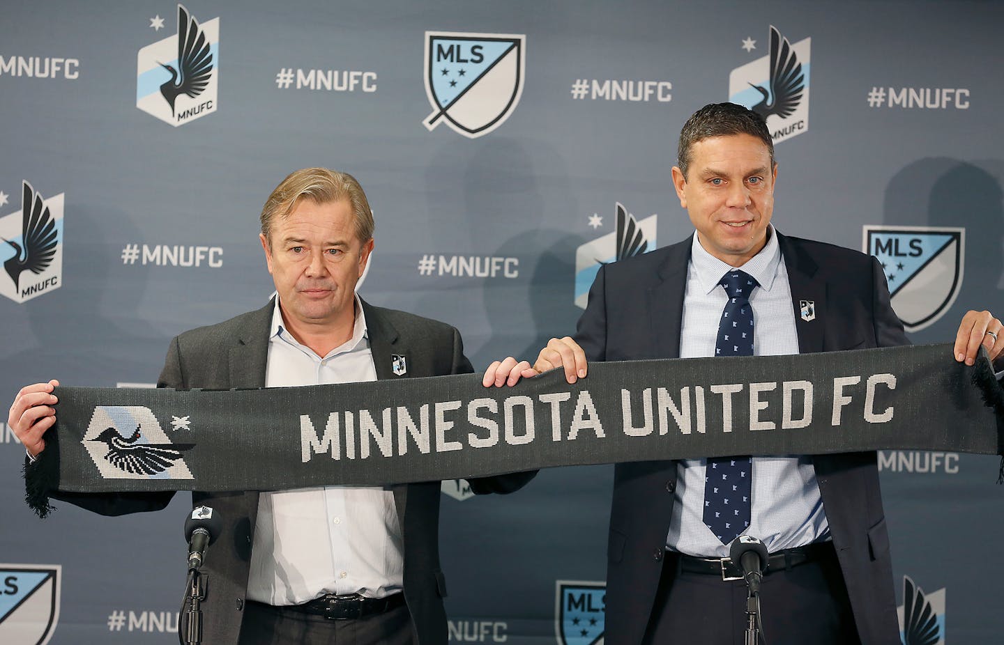 Minnesota United coach Adrian Heath, left and Sporting Director Manny Lagos have the first pick in Friday's MLS SuperDraft.