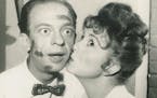 Thelma Lou (Betty Lynn) kissing Barney (Don Knotts) in a publicity photo for "The Andy Griffith Show."