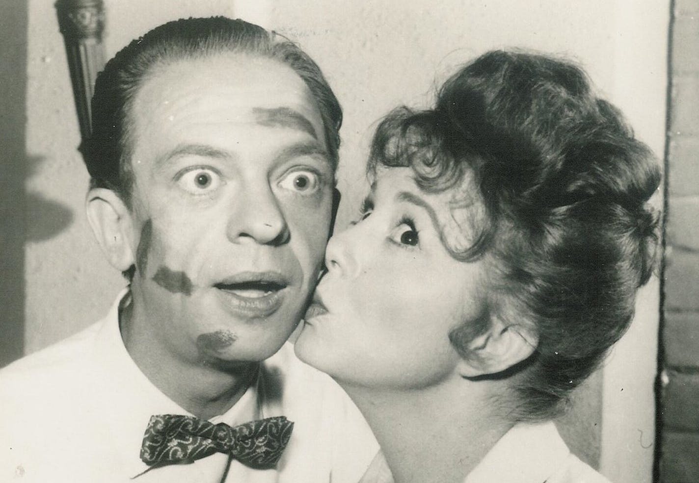 Thelma Lou (Betty Lynn) kissing Barney (Don Knotts) in a publicity photo for "The Andy Griffith Show."