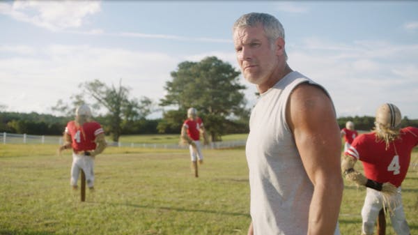 Brett Favre gazes at secret agents approaching him in a TV commercial Buffalo Wild Wings will air during the Super Bowl pregame show on Sunday. The Go