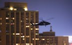 Army special operations unit helicopters flew training exercises over downtown Minneapolis about 10 PM Tuesday night. ] MAGIC SAXO NUMBER IS 494723 Un