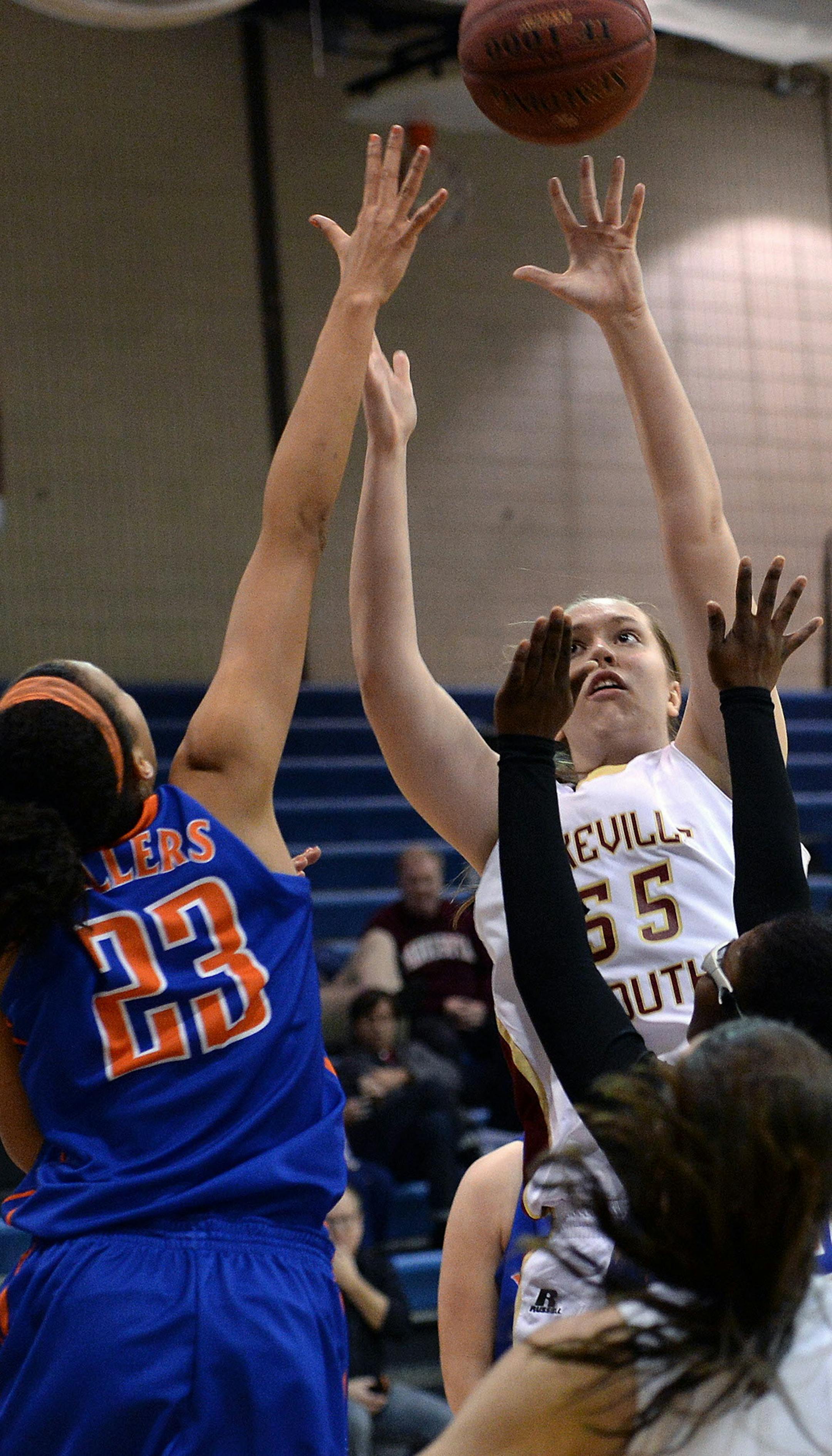 Washburn's Chase Coley reaches to block Lakeville South's Katie Quandt's shot during the second half of the season opening game Tuesday, December 3 at Washburn. ] (SPECIAL TO THE STAR TRIBUNE/BRE McGEE) **Chase Coley (blue, 23), Katie Quandt (white, 55)