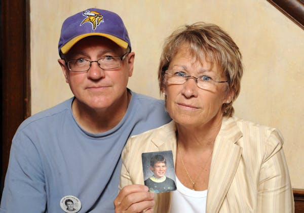Patty and Jerry Wetterling hold a photo of their son Jacob, who was abducted in October of 1989 in St. Joseph, Minn.