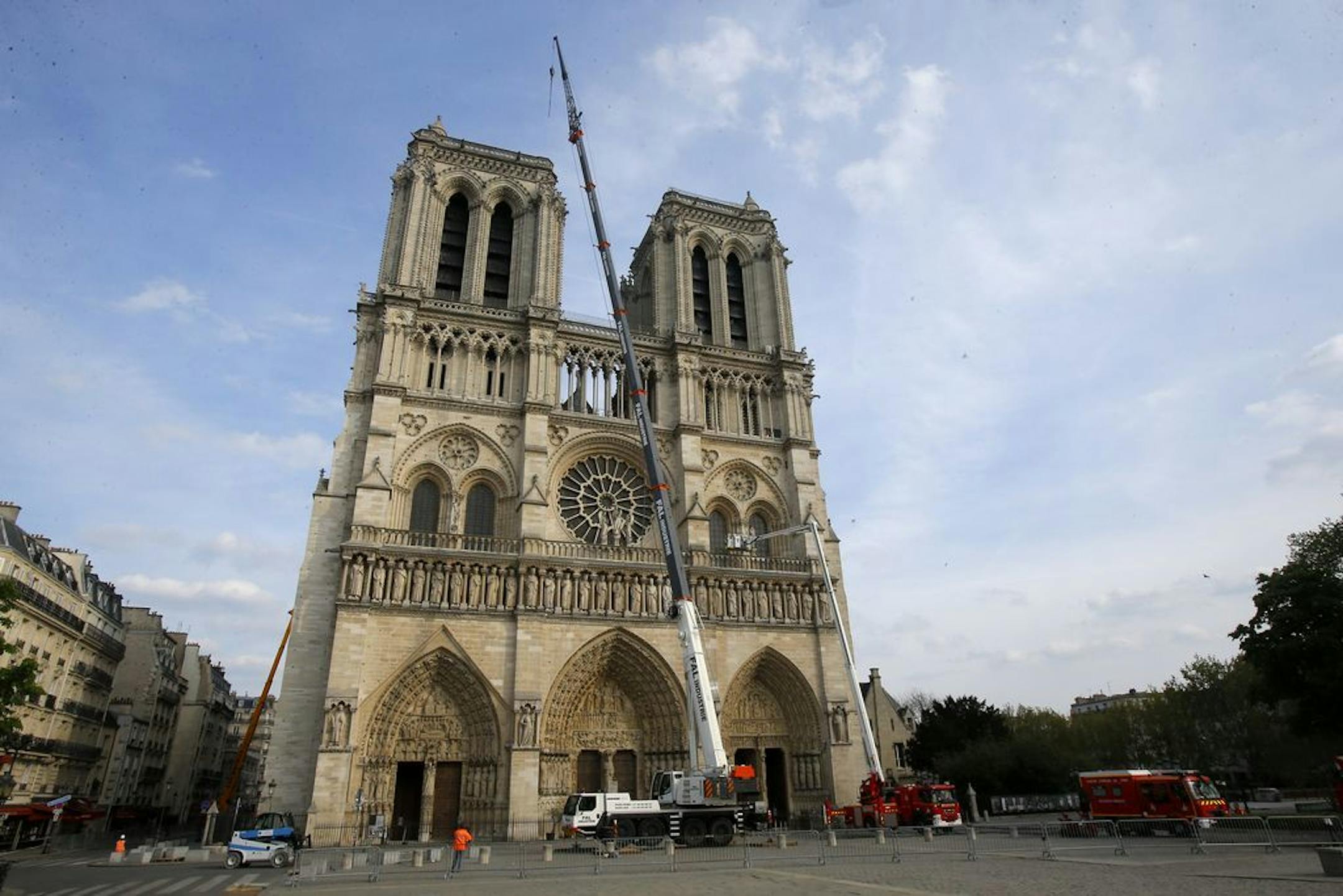 Notre Dame cathedral is pictured after a ceremony at the city town hall, Thursday, April 18, 2019 in Paris. France paid a daylong tribute Thursday to the Paris firefighters who saved Notre Dame Cathedral from collapse, while construction workers rushed to secure an area above one of the church's famed rose-shaped windows and other vulnerable sections of the fire-damaged landmark.